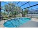Inviting screened pool and spa with a lovely outdoor view and ample sunlight at 6605 38Th E Ln, Sarasota, FL 34243