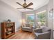 Bright sitting room with hardwood floors, large windows, and comfortable seating at 6605 38Th E Ln, Sarasota, FL 34243