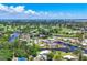 Stunning aerial view showcasing canal-front homes and lush greenery at 6931 Magellan Way, Sarasota, FL 34243