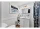 Bright bathroom featuring a modern vanity, stylish fixtures, and elegant tile flooring at 6931 Magellan Way, Sarasota, FL 34243
