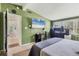 Spacious bedroom with a gaming setup and an open door at 6931 Magellan Way, Sarasota, FL 34243