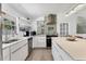 Modern kitchen featuring stainless steel appliances, sleek countertops, and bright lighting at 6931 Magellan Way, Sarasota, FL 34243