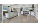 Bright living space flowing into an adjacent dining room and the kitchen area at 6931 Magellan Way, Sarasota, FL 34243