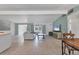 Open-concept living room with light-filled spaces and a modern sofa at 6931 Magellan Way, Sarasota, FL 34243