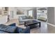 Comfortable living room with light colors, an open-concept design, and access to a bedroom at 6931 Magellan Way, Sarasota, FL 34243
