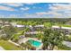 Aerial view of the community showcasing the pool, landscaping, and surrounding golf course at 7193 W Country Club N Dr # 137, Sarasota, FL 34243