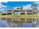 Water view of the backyard of this property with a screened lanai overlooking the serene water at 7193 W Country Club N Dr # 137, Sarasota, FL 34243