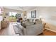 Comfortable living room featuring a plush sofa, cozy furniture, and views of the golf course at 7193 W Country Club N Dr # 137, Sarasota, FL 34243