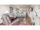 Spacious living area with a comfortable sofa, a view of the dining area and a desk space at 7193 W Country Club N Dr # 137, Sarasota, FL 34243