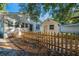 Backyard featuring a home with a picket fence and a storage shed at 720 37Th W St, Bradenton, FL 34205