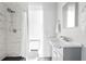 Bathroom featuring a shower with marble-look tiles, vanity, and a toilet at 720 37Th W St, Bradenton, FL 34205