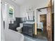 Bathroom featuring a tub, marble-top vanity, black paneled walls, and access to the bedroom at 720 37Th W St, Bradenton, FL 34205
