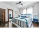 Bedroom with a blue metal bed frame and a view of the bathroom with a claw foot tub at 720 37Th W St, Bradenton, FL 34205
