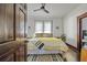 Cozy bedroom with decorative rug, stylish bedding, and natural light from the window at 720 37Th W St, Bradenton, FL 34205