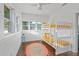 Bedroom featuring white bunk beds with gold bedding and throw pillows at 720 37Th W St, Bradenton, FL 34205
