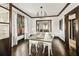Open-concept dining room with hardwood floors, natural light, and seamless flow to the living area at 720 37Th W St, Bradenton, FL 34205