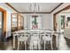 Bright dining room features a classic table, ample seating, and decorative cabinet at 720 37Th W St, Bradenton, FL 34205