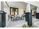 Cozy front porch features stylish seating, black brick accents, and a welcoming ambiance at 720 37Th W St, Bradenton, FL 34205