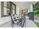 Inviting front porch with comfortable seating and decorative pillows at 720 37Th W St, Bradenton, FL 34205
