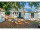 View of the rear exterior of the home with a metal roof and fenced yard at 720 37Th W St, Bradenton, FL 34205