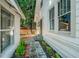 Exterior shot of the home showing the side yard and walkway to the backyard at 720 37Th W St, Bradenton, FL 34205