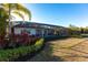 Expansive backyard featuring lush landscaping and a screened enclosure, creating a private oasis at 7208 Prestbury Cir, Bradenton, FL 34202