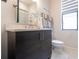 Modern bathroom with a vanity, mirror and clean fixtures at 7208 Prestbury Cir, Bradenton, FL 34202