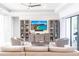 Modern living room with comfortable seating, a ceiling fan, and stylish decor, creating a welcoming atmosphere at 7208 Prestbury Cir, Bradenton, FL 34202