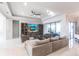 The stylish living room offers ample seating, a ceiling fan, and a large television for entertainment at 7208 Prestbury Cir, Bradenton, FL 34202