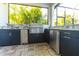 This outdoor kitchen is complete with stainless steel appliances and granite countertops at 7208 Prestbury Cir, Bradenton, FL 34202