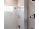 Bright white shower featuring a sleek shower-head and tiled walls at 7208 Prestbury Cir, Bradenton, FL 34202