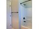 Bathroom area features a white tub and shower combination and a black shower head at 7311 64Th St E, Palmetto, FL 34221