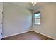 Vacant bedroom with a ceiling fan, window, wood-look floors, and a closet at 7311 64Th St E, Palmetto, FL 34221