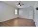 Minimalist bedroom featuring a ceiling fan, wood floors, and plenty of space at 7311 64Th St E, Palmetto, FL 34221