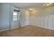 This entry hall has tiled floors, a front door, and decorative wainscoting at 7311 64Th St E, Palmetto, FL 34221