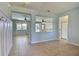 This expansive entryway offers views through to the kitchen and living spaces and decorative wainscoting at 7311 64Th St E, Palmetto, FL 34221