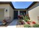 Front porch featuring vibrant landscaping, a charming entryway, and stone accents at 7311 64Th St E, Palmetto, FL 34221