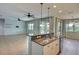 Modern open kitchen with granite counters and sink overlooking the living area and pool at 7311 64Th St E, Palmetto, FL 34221