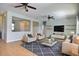 Cozy living room featuring neutral paint, ceiling fans, light furniture, a modern rug and tile floors at 7311 64Th St E, Palmetto, FL 34221