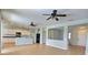 Open concept living space showcases tile flooring connecting the kitchen with stainless appliances at 7311 64Th St E, Palmetto, FL 34221