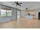 Open living space with tile flooring and a view of the kitchen, perfect for entertaining at 7311 64Th St E, Palmetto, FL 34221