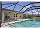 This screened-in pool and patio is great for outdoor entertaining at 7311 64Th St E, Palmetto, FL 34221
