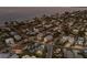 Stunning aerial view of a coastal neighborhood with beach access and beautiful homes, close to the ocean at 799 Jacaranda Rd, Anna Maria, FL 34216