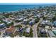Expansive aerial view of a charming coastal community with lush landscaping near the ocean at 799 Jacaranda Rd, Anna Maria, FL 34216