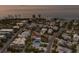 Tranquil coastal neighborhood featuring a mix of homes near the beach, set against the backdrop of the ocean at 799 Jacaranda Rd, Anna Maria, FL 34216