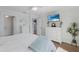 Bright bedroom featuring light blue walls, white furnishings, and a ceiling fan for a relaxing atmosphere at 799 Jacaranda Rd, Anna Maria, FL 34216