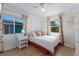 Cozy bedroom with natural light, decorative accents, and wood floors at 799 Jacaranda Rd, Anna Maria, FL 34216
