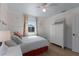 A serene bedroom with light colored walls, wood floors, and elegant furnishings at 799 Jacaranda Rd, Anna Maria, FL 34216