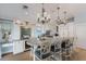 Bright kitchen features marble island with seating, pendant lighting, and luxury appliances at 799 Jacaranda Rd, Anna Maria, FL 34216