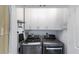 Laundry room includes storage and modern appliances at 799 Jacaranda Rd, Anna Maria, FL 34216
